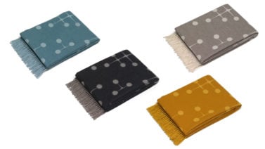 wool dot blankets in blue, mustard, gray, and black