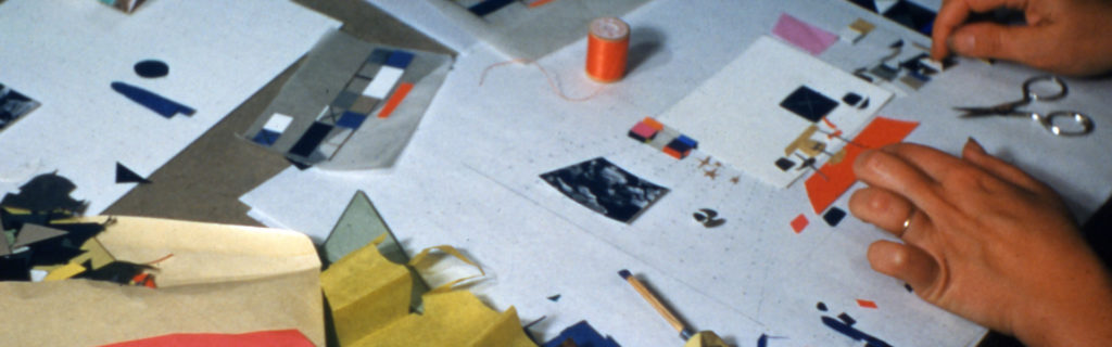 A close up of Ray Eames's hands as she works through a new design on paper