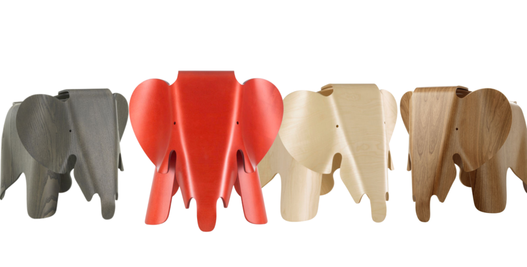 A group of Eames Molded Plywood Elephants