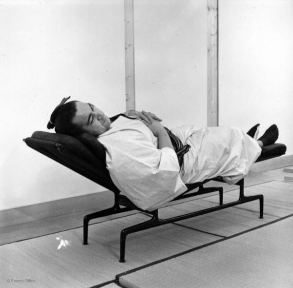 Sumo wrestler on an Eames Chaise Lounge